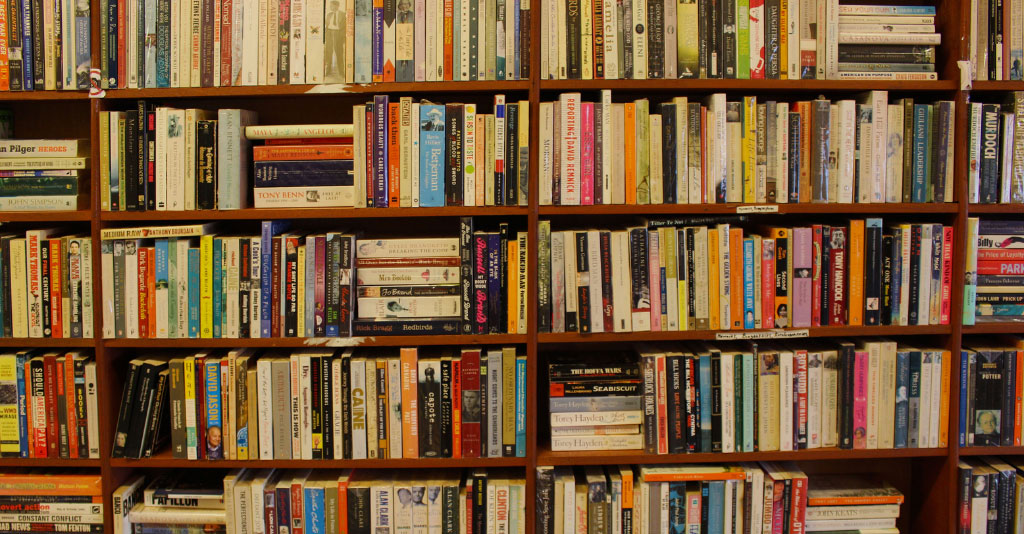 Image of an over-filled bookshelf