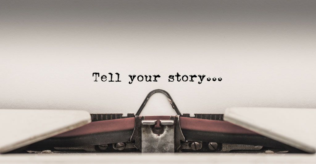 Close-up image of a typewriter with paper that says "Tell you story..."