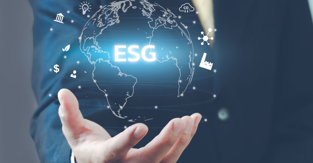 Man holding holographic image of the globe with "ESG" in the center, along with icons depicting energy.