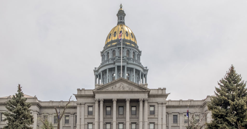 Image of the front of the Colorado state capitol on an overcast day.